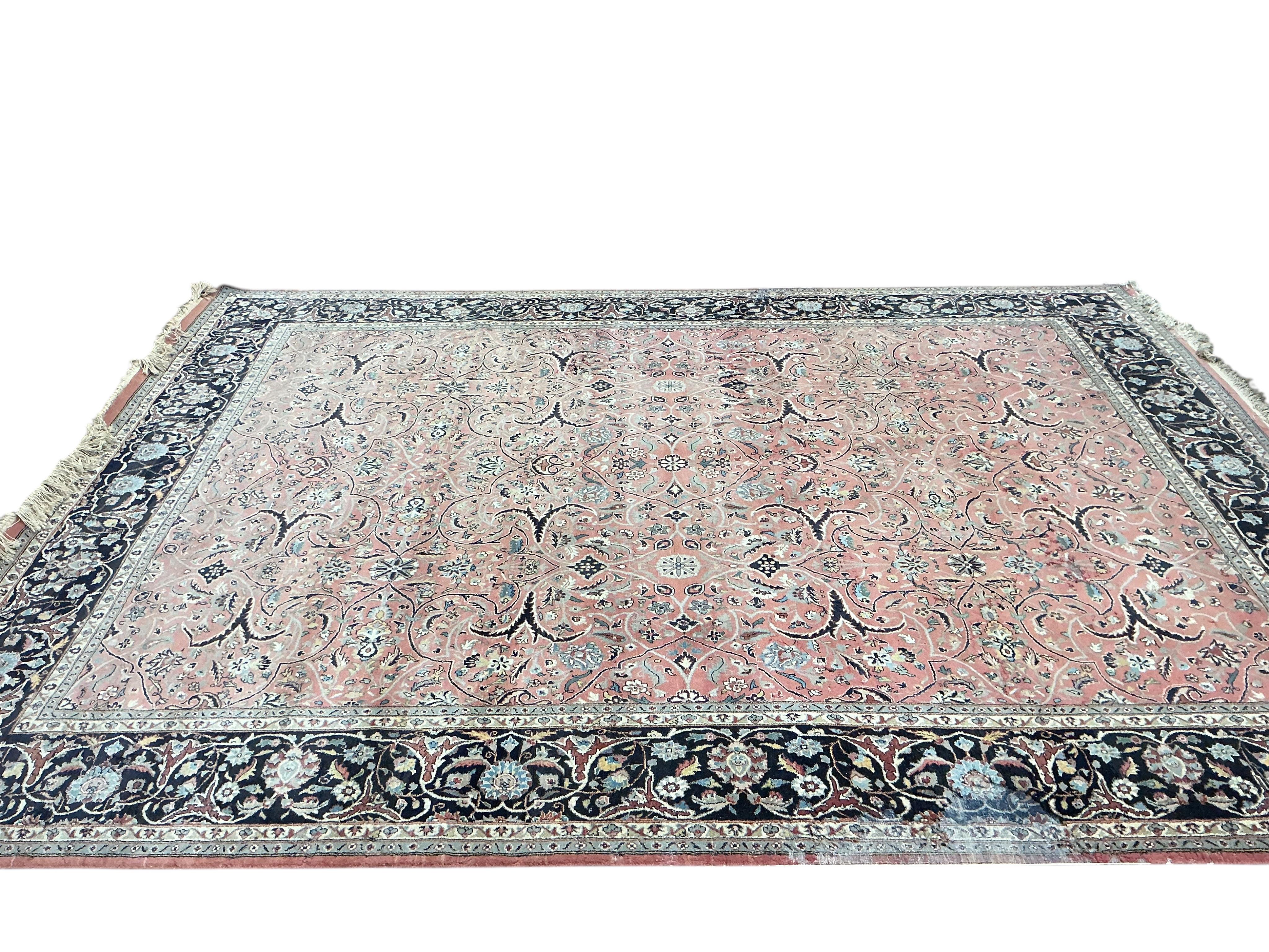 A Tabriz peach ground carpet, 330 x 248cm